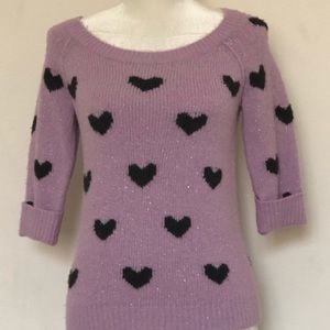 Purple sweater with black hearts